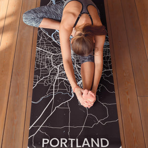 Stretching on personlized print yoga mat with Portland Map